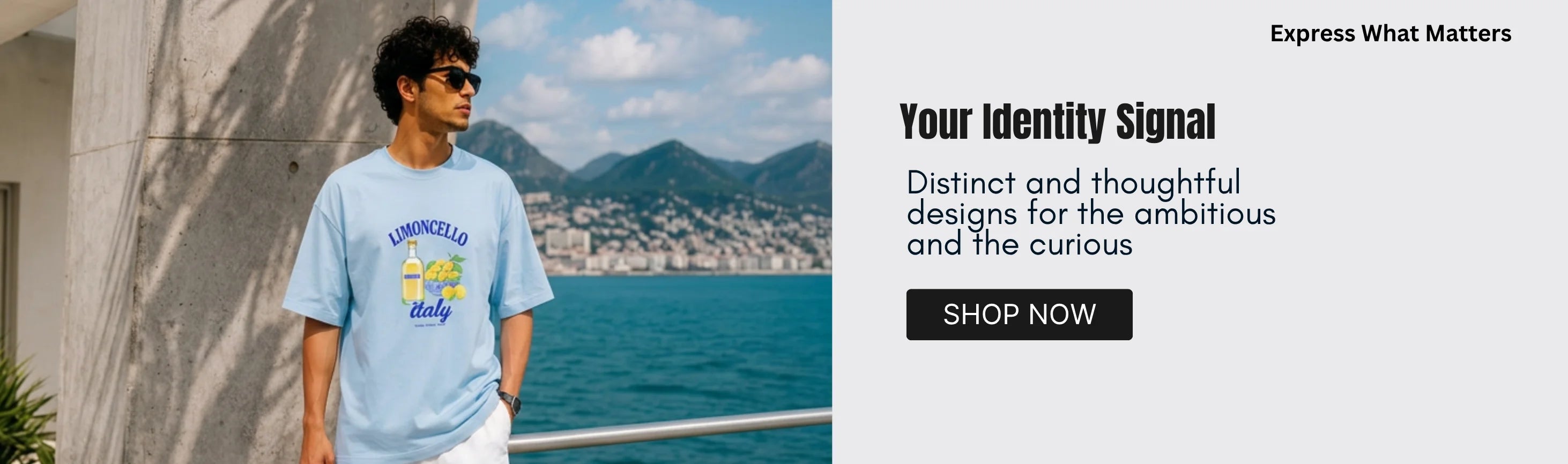 A man wearing a light blue graphic t-shirt stands by a coastal walkway with a sea and mountains in the background. The right side of the image features a promotional text block with the headline 'Your Identity Signal', subtext, and a 'SHOP NOW' button.
