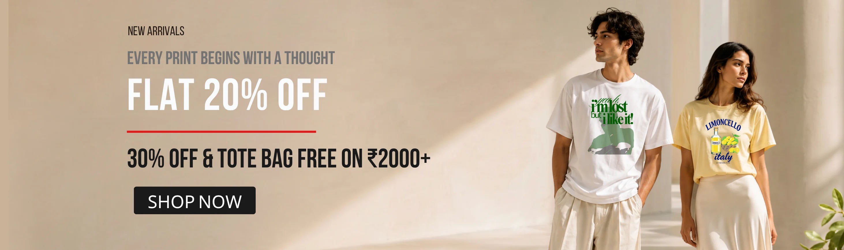 Promotional banner for a clothing store with text on the left reading 'NEW ARRIVALS', 'EVERY PRINT BEGINS WITH A THOUGHT', 'FLAT 20% OFF', '30% OFF & TOTE BAG FREE ON ₹2000+', and a 'SHOP NOW' button. On the right, a man and a woman model graphic T-shirts in a bright indoor setting.